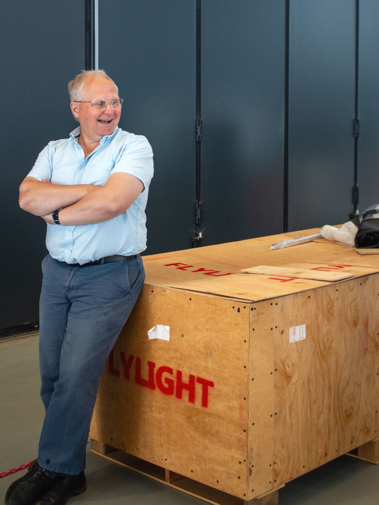 Prof. Guy Gratton in front of one of the crates